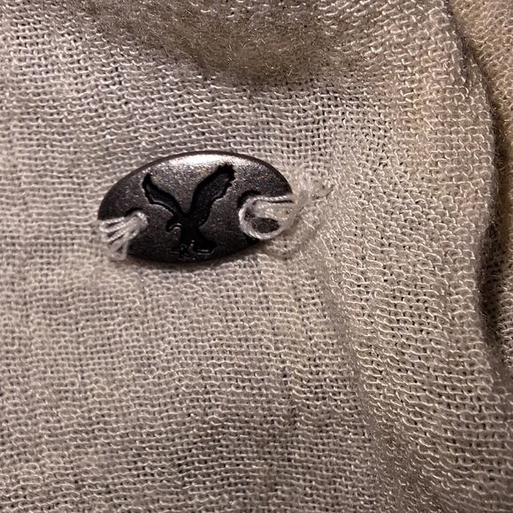 An American Eagle sheer and lace low-cut blouse in a size medium. - Picture 4 of 9